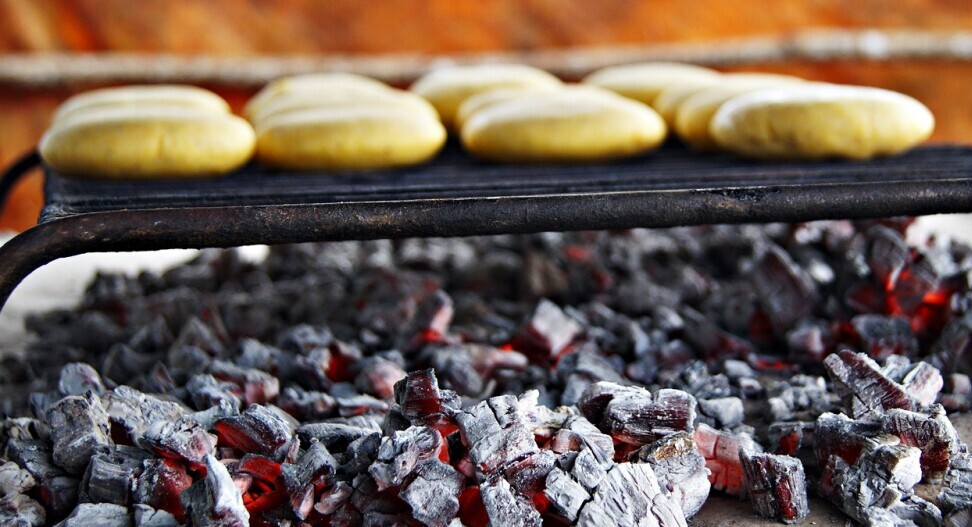 Arepas being cooked